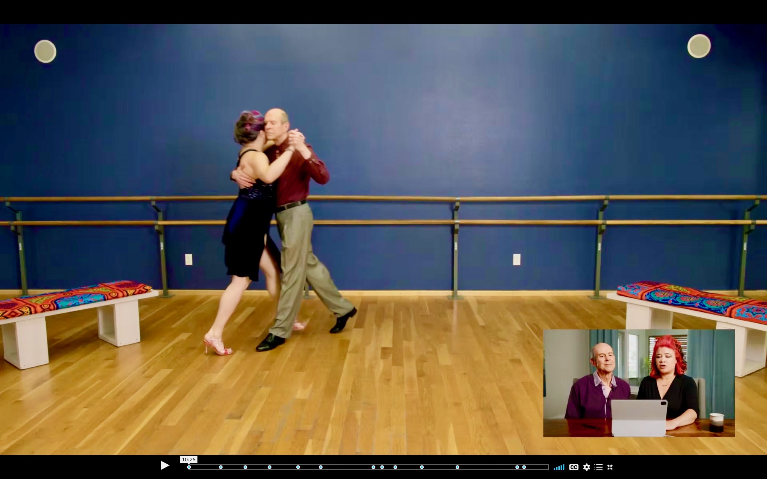 Argen and Tina in an inset picture-in-picture, commenting on their dancing in the full-size picture